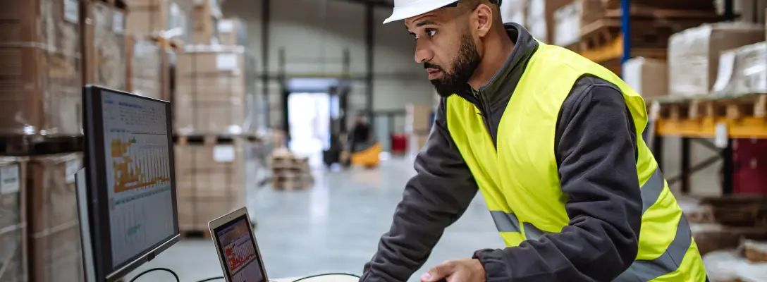 Man reviewing shipping analytics for rate optimization